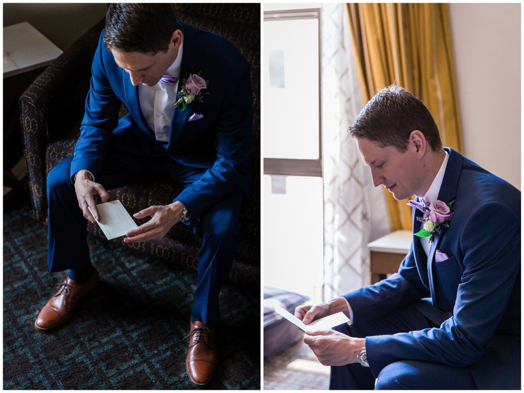 Groom in Milwaukee wearing navy suit reading letter from the bride on their wedding day 