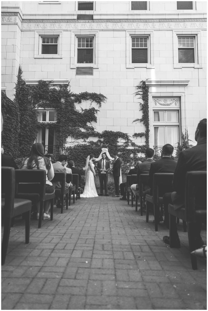 Black and white image of marriage ceremony in downtown Milwaukee