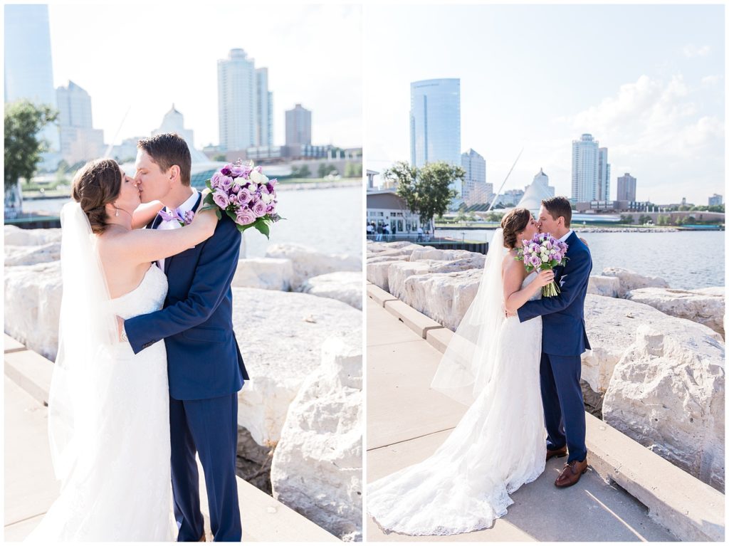 Bride and groom kissing by Lake Michigan with Milwaukee skyline in the background