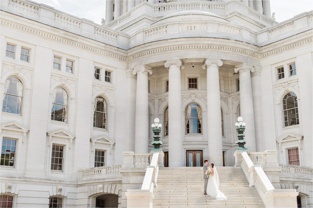 Bride and Groom at the Wisconsin State Capitol Building on their Monona Terrace wedding day