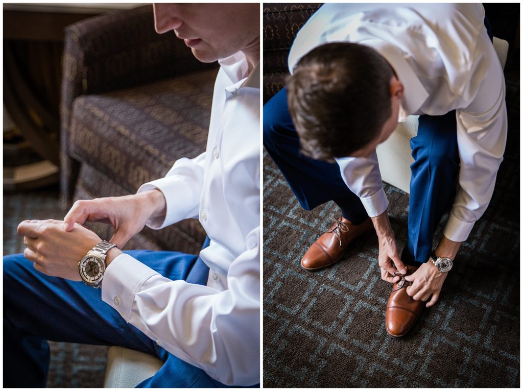 Groom getting ready for wedding day in Milwaukee by tying shoes and buckling his watch